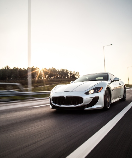 sliver-metallic-color-sport-car-driving-with-high-speed-road